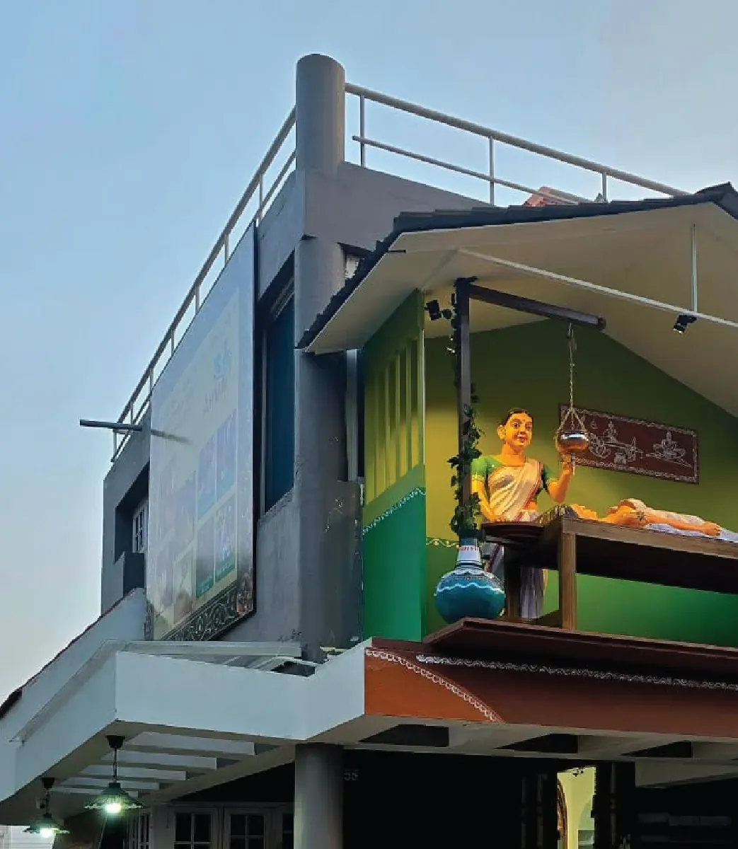 Amay India's TK Layout centre in Mysuru, with a Shirodhara sculpture on the green balcony