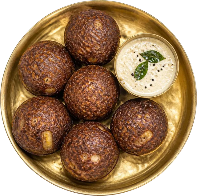 Illustration: ragi banana paniyaram on a brass plate with coconut chutney